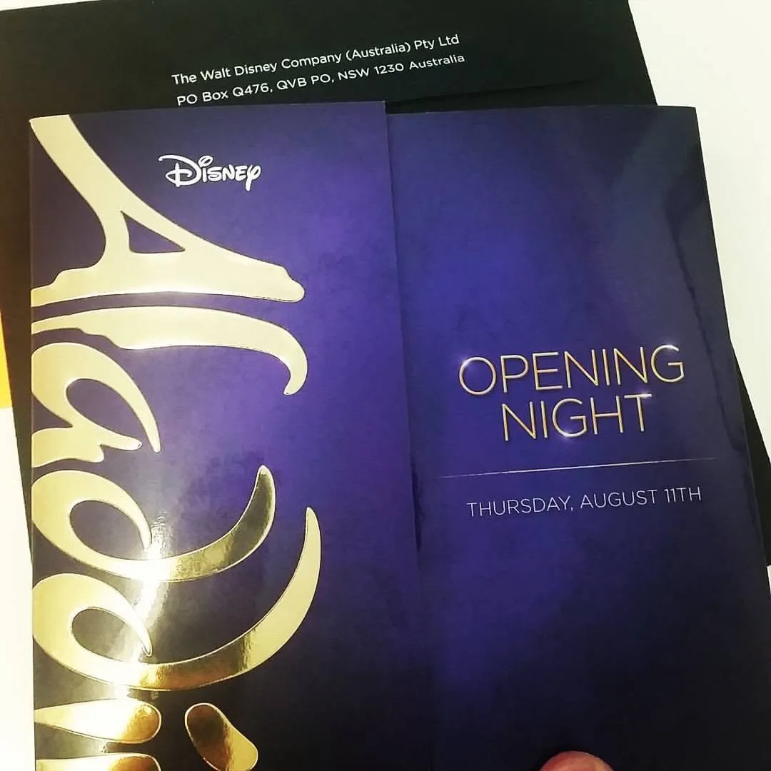 Disney's Aladdin opening-night invitation with purple and gold artwork