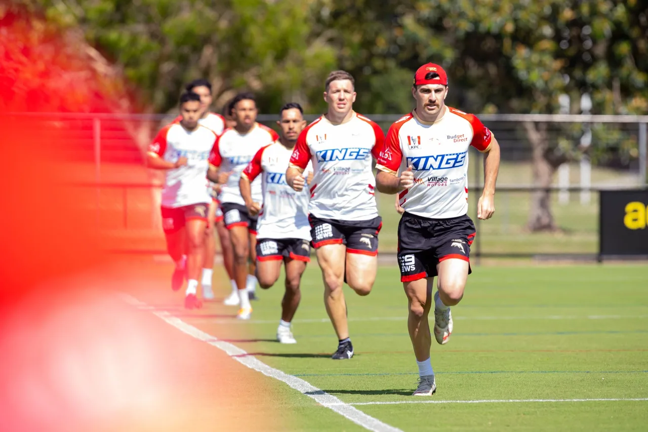 Dolphins players running together along the training field