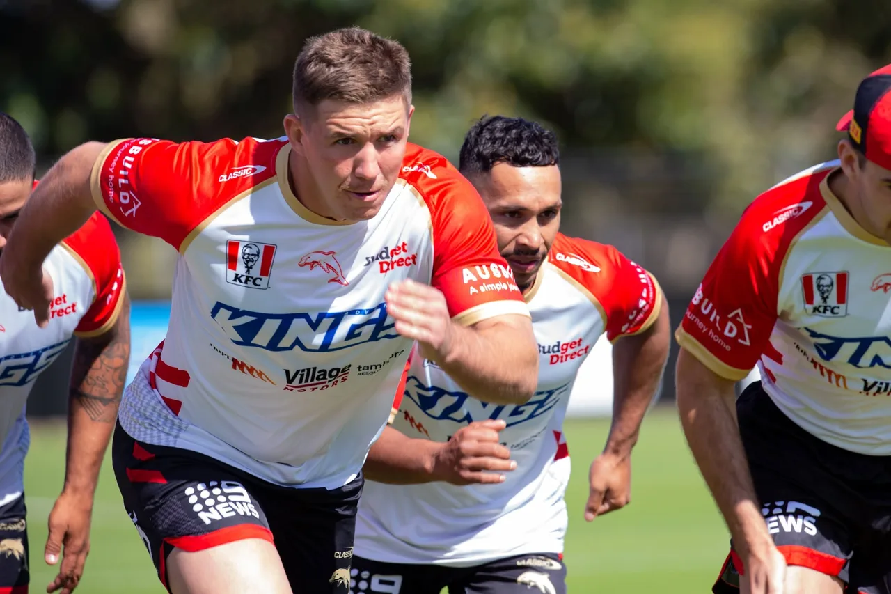 Dolphins players accelerating during an outdoor training session