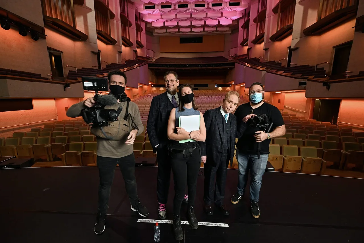 Penn & Teller with the filming crew inside a QPAC auditorium