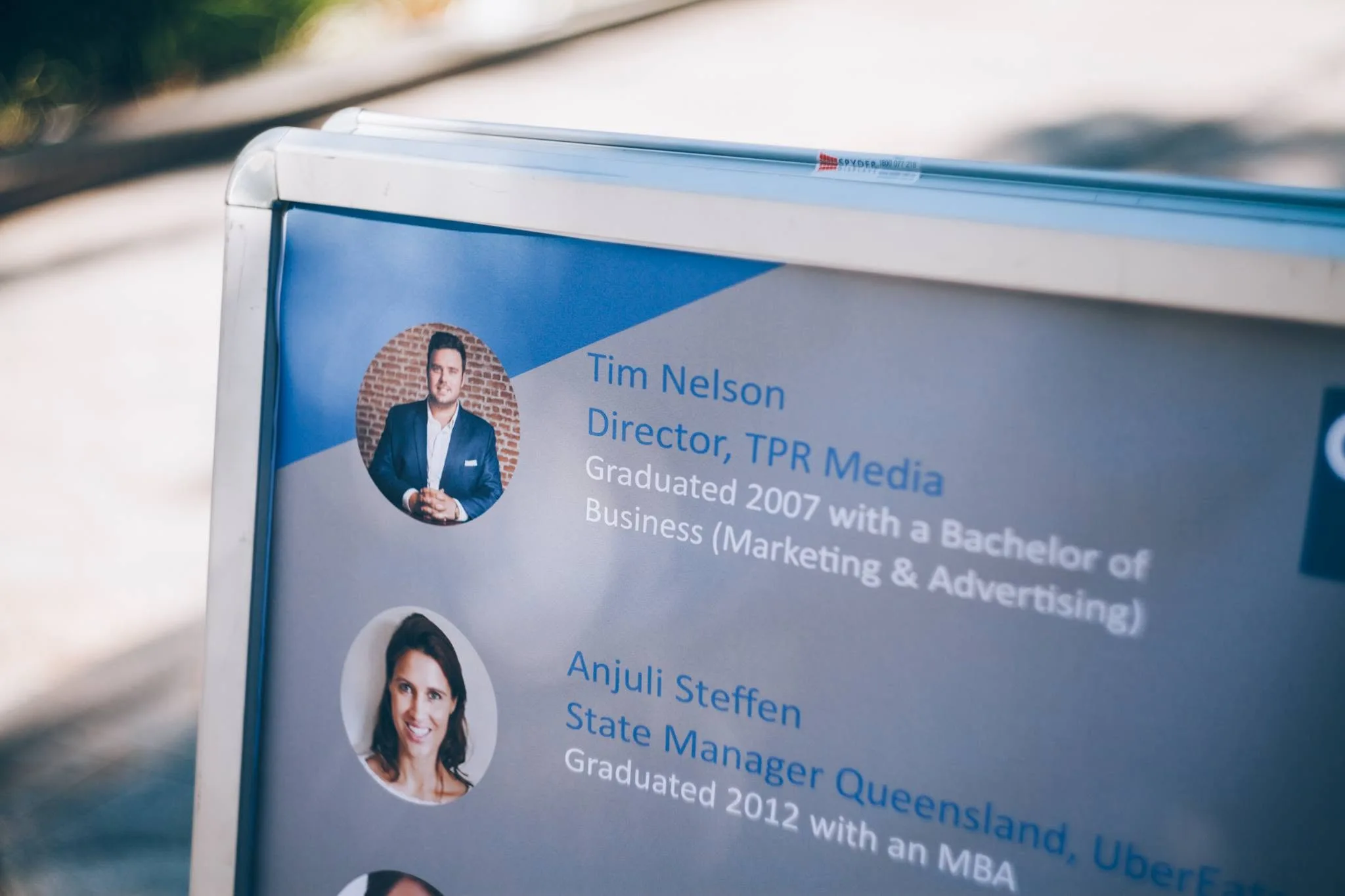 Event speaker signage identifying Tim Nelson as Director of TPR Media
